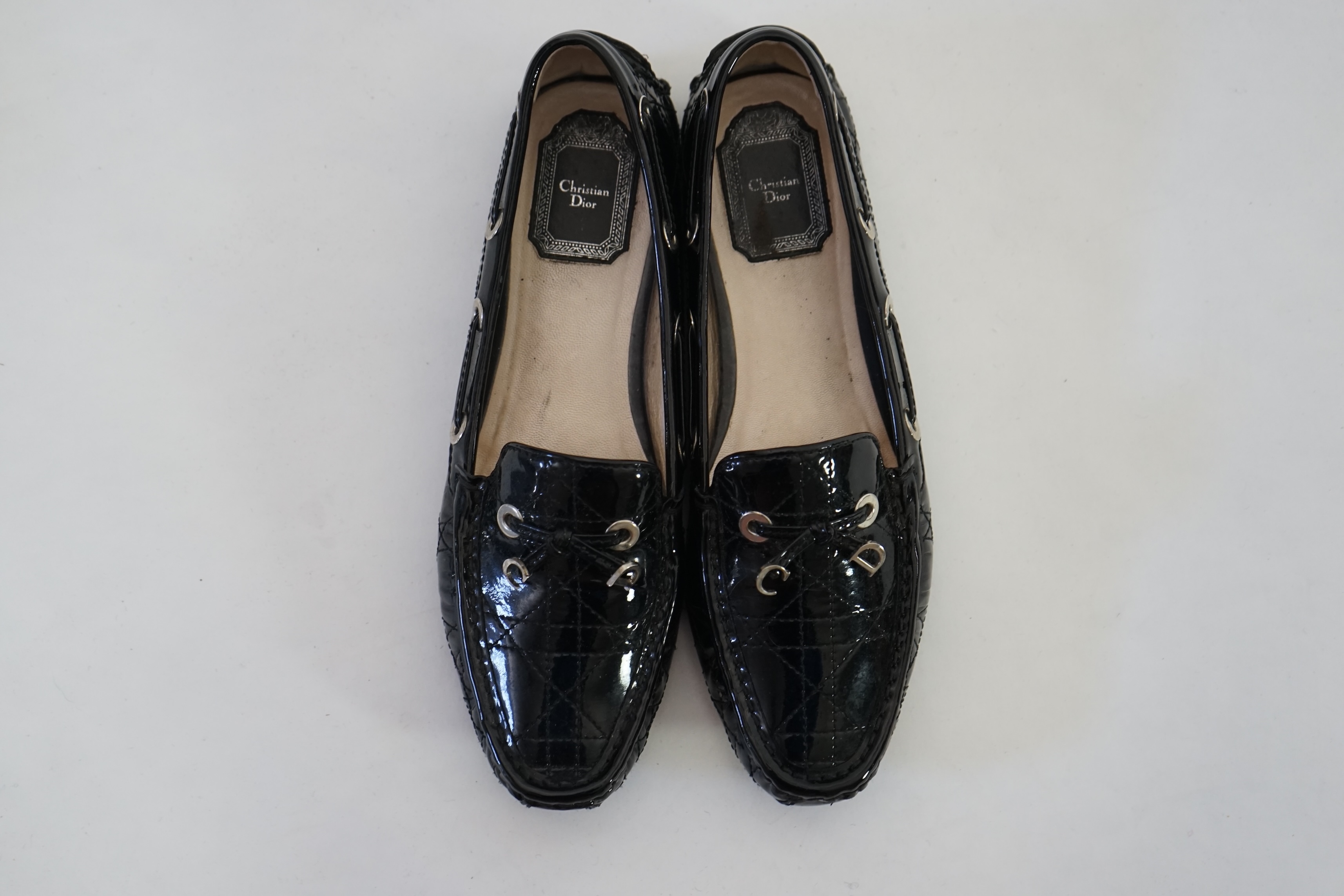 A pair of Christian Dior black patient leather lady's driving shoes with dustbag and in original box. Size 38.5. Proceeds to Happy Paws Puppy Rescue